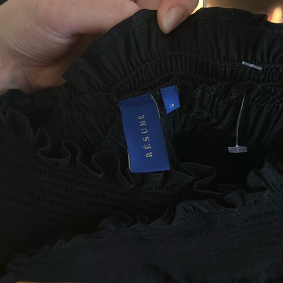 Cute off-the-shoulder black top. Sinches at top, flows on bottom. No stains! - Picture 2 of 2